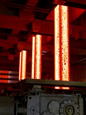 TimkenSteel's jumbo bloom vertical caster makes sections of special bar quality (SBQ) steel that measure up to 18 inches x 24 inches, referred to as "jumbo blooms," which are later rolled into bars and tubes. The steel stands shown here are 11 inches x 17 inches.